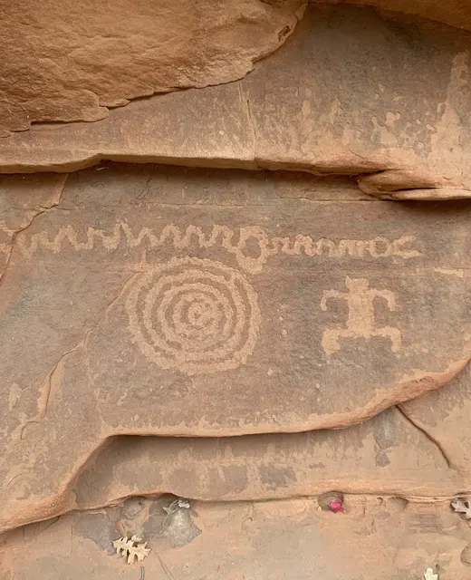 Ancient petroglyphs on sandstone canyon wall at Zion National Park