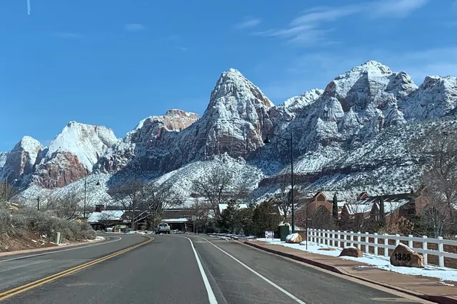Snow-dusted Zion peaks above the main road through Springdale in winter