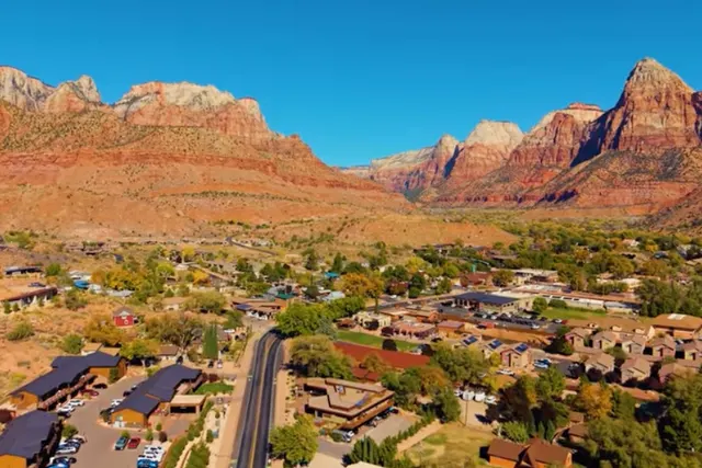 Aerial view of Springdale, Utah below the red cliffs of Zion